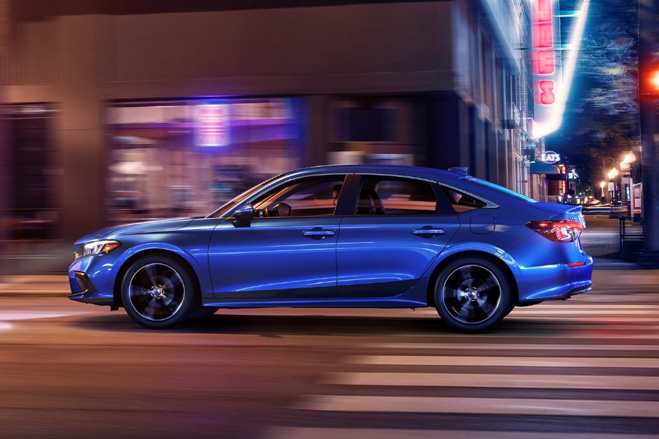 Honda Civic driving on a city road