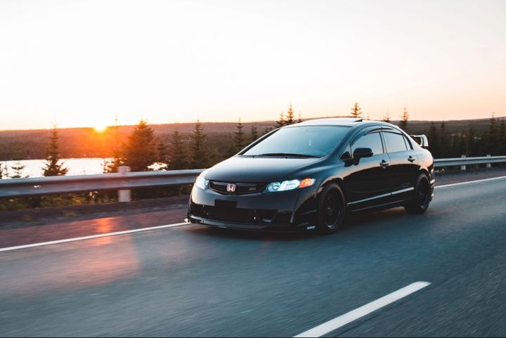 A black Honda Civic sedan 