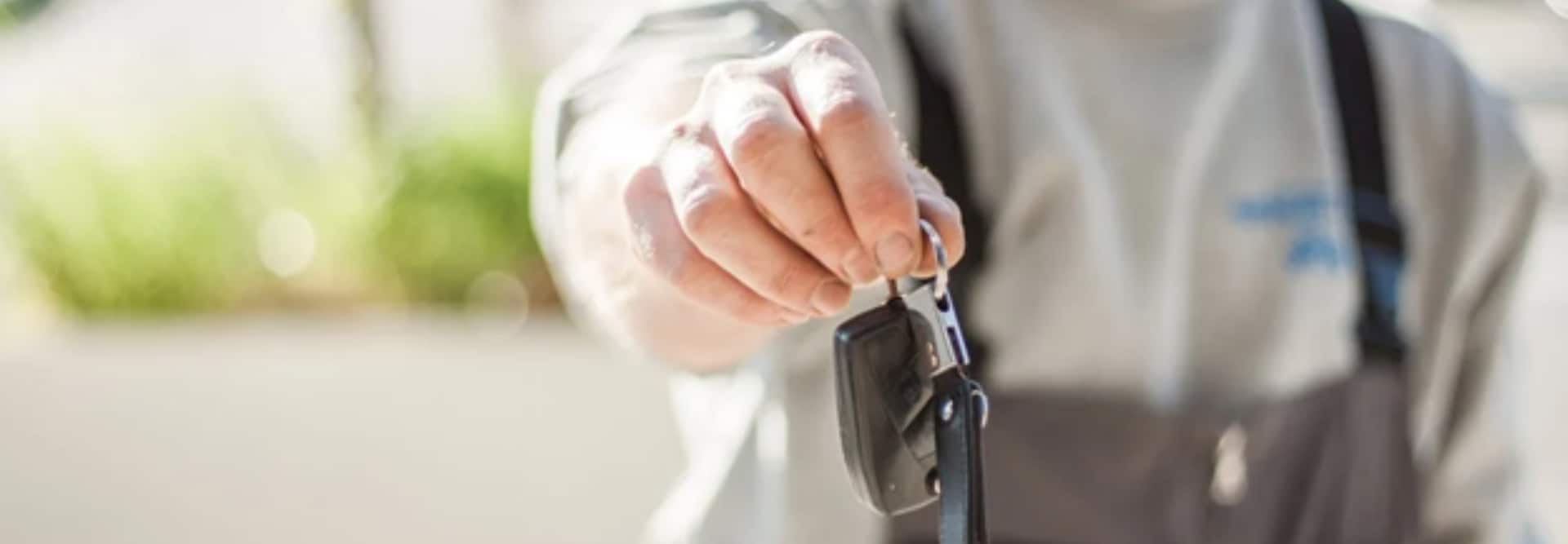 Car Key held by a Man