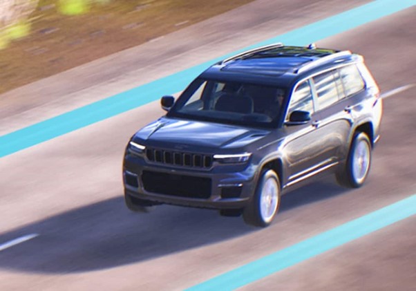 Jeep car driving on road