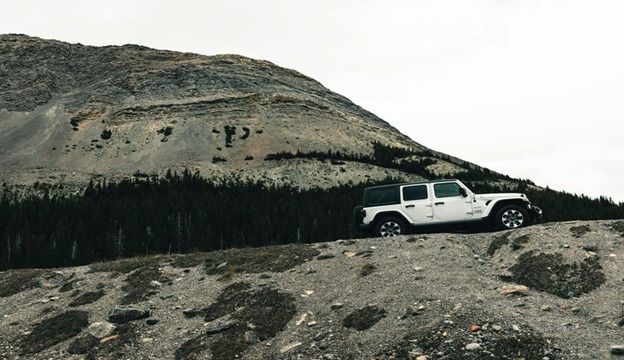 Jeep car on top of mountain