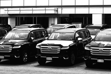 Toyota cars parked up infront of a building