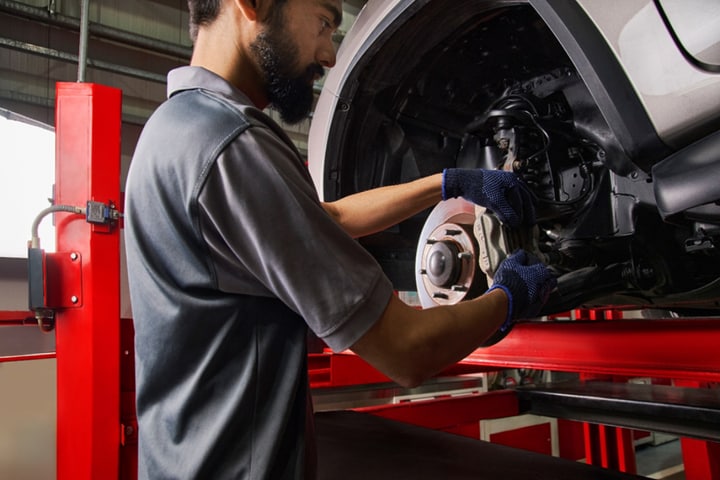 A mechanic fixing a car