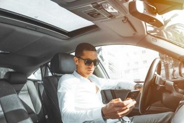 A man in a car with a sunroof