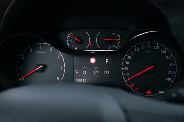 Car dashboard with warning lights illuminated