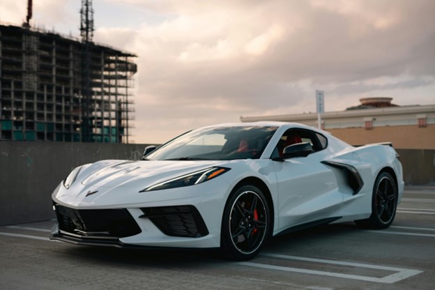 A white Chevrolet Corvette parked on the road