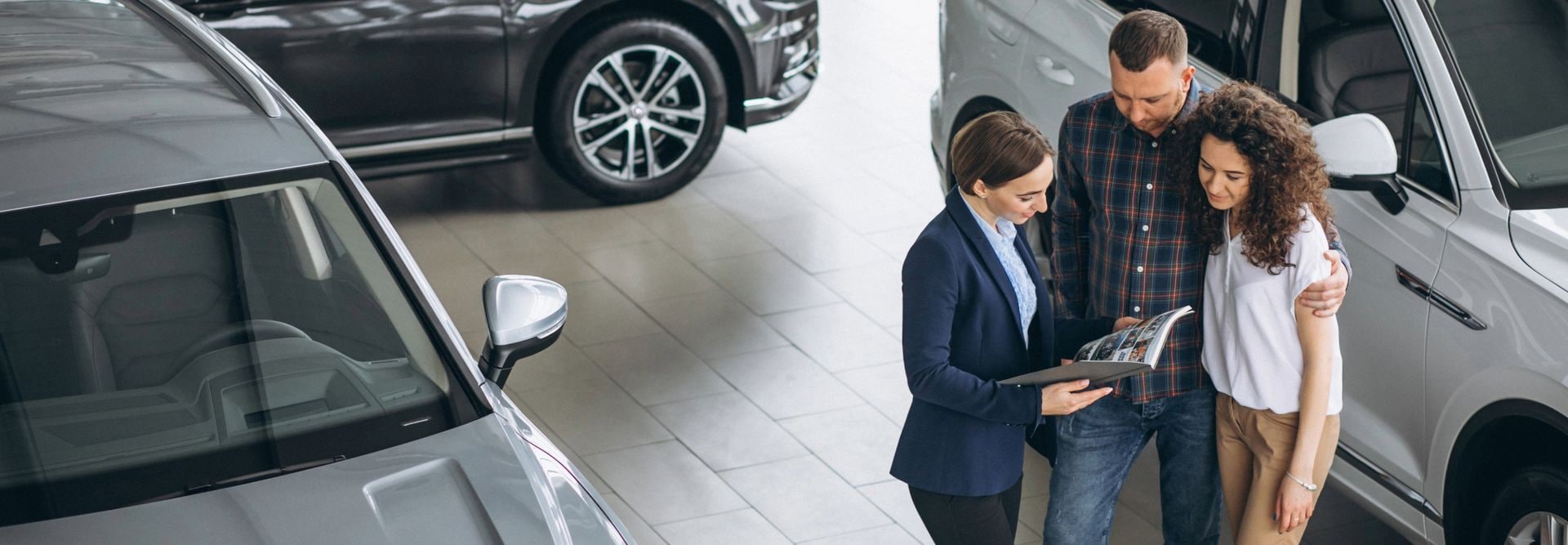 A Sales person in a showroom serving customers