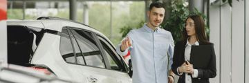 Stylish and elegant people in a car salon. Source: https://www.freepik.com/
