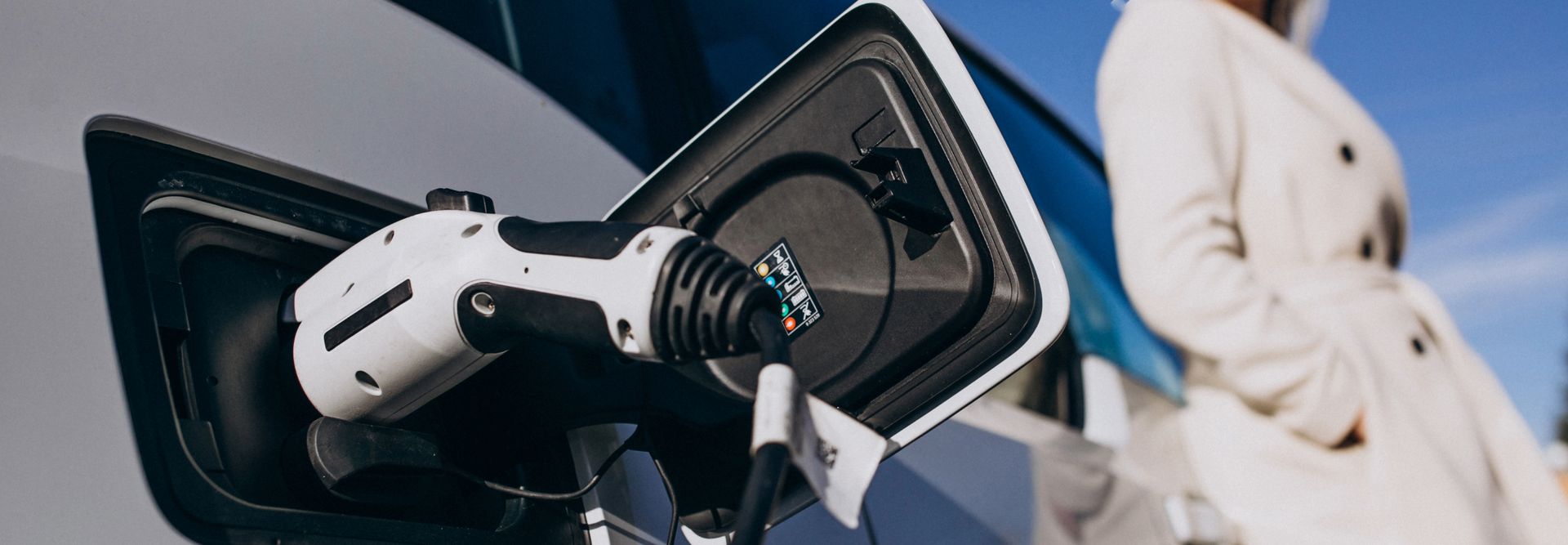 An electric car being charged on the charging station
