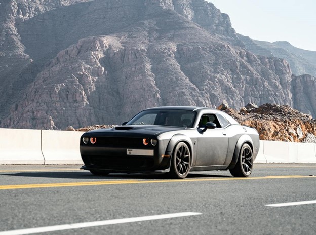Dodge Challenger on a Road in Mountains