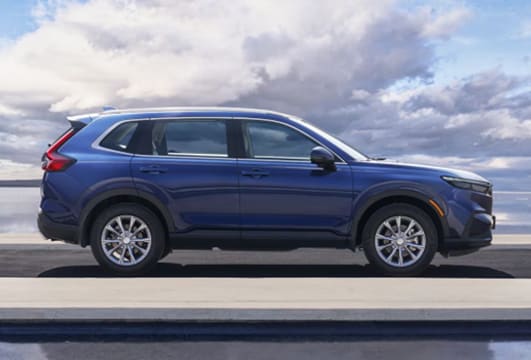 Side view of a blue Honda CH-R SUV