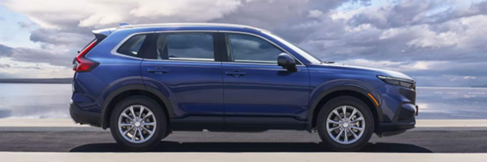 Side view of a blue Honda CH-R SUV