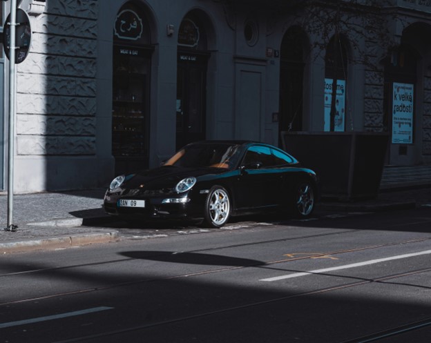 A Black Porsche Carrera Parked on the Road