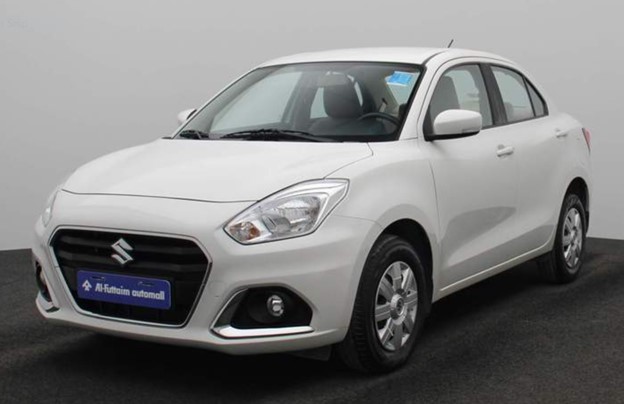 A white Suzuki Dzire