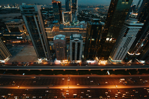 Aerial View of City Buildings During Night Time in Dubai
