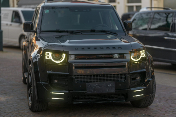 Black land rover defender parked outdoors