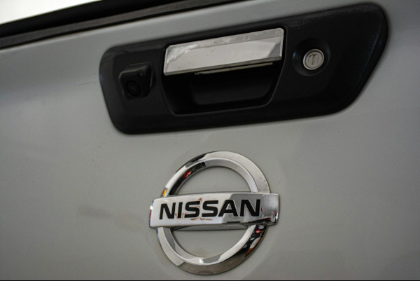a close up of a nissan emblem on a car
