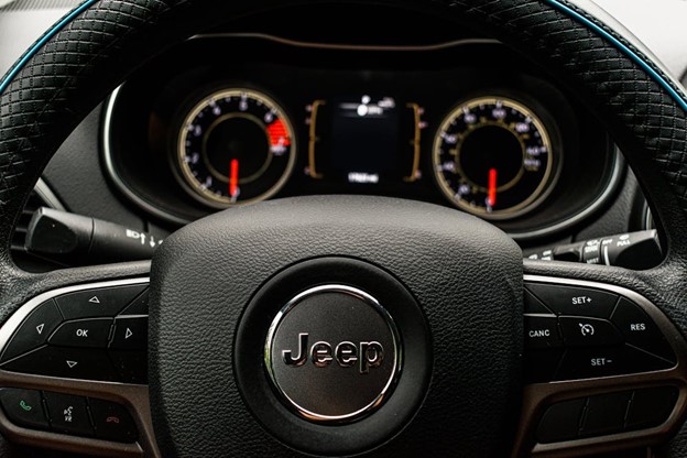 View of Jeep steering wheel showing cruise control stick