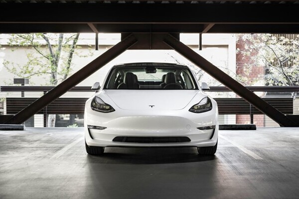 Front view of a white Tesla model 3 electric car