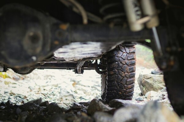 Car suspension of a car perked on some rocks.
