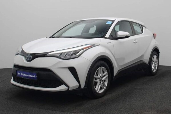 Side view of a white Toyota C-HR Hybrid car